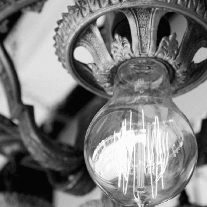 A close up of the light bulb on a chandelier A close up of the light bulb on a chandelier