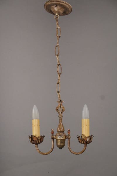 10425. 1920's Two Light Pendant With Acanthus Motif with two electric candles, ornate leaf motifs, and a linked chain, mounted against a gray background.