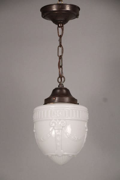 10498. 1930's Glass Pendant With Floral Wreath with ornate designs, suspended by a chain from a bronze-colored fixture.