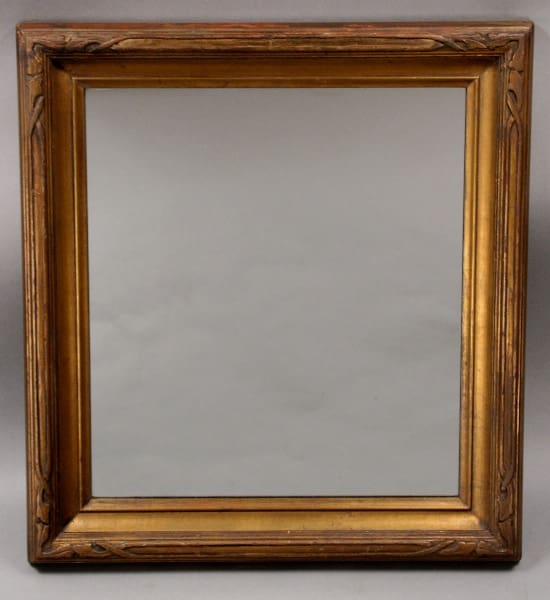 An empty 10607. 1920's Hand Carved Gilt Mirror against a neutral gray background.