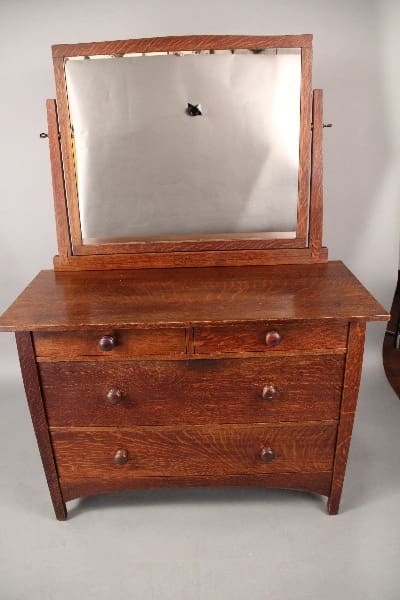 10612. Arts And Crafts Gustav Stickley Dresser With Mirror Circa 1910 with a large square mirror, featuring visible wear and a small, dark blemish on the mirror.
