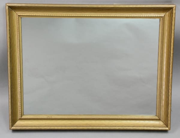 10617. 1920's Wood Mirror With Original Gold Finish on a gray background.