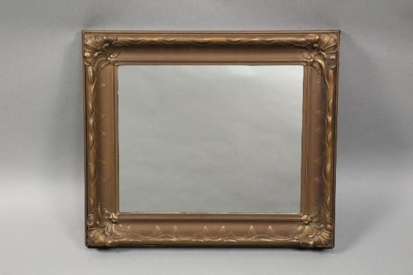 10618. Circa 1920's Wood Mirror With Nice Plaster Details with an ornate gold frame featuring intricate scroll and leaf patterns, displayed against a neutral gray background.