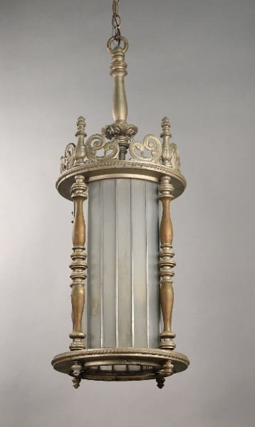 An ornate 10721. Impressive Large Scale 1920's Spanish Revival Glass Pendant with a crown-like top, vertical bars, and decorative elements, suspended against a plain background.