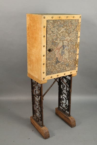 11141. European Cabinet With Iron Legs with ornate tapestry panel on stand