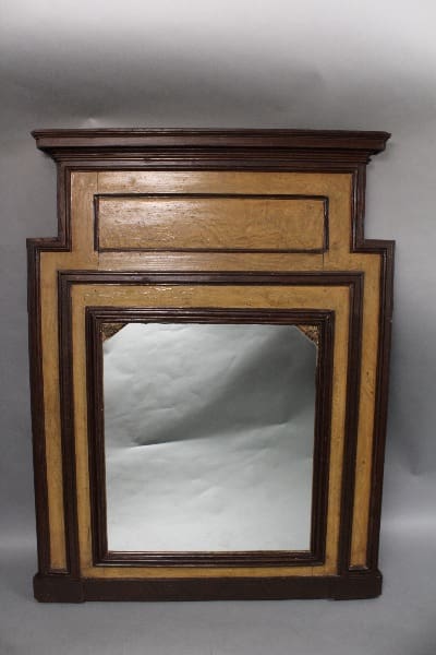 Antique wooden mantelpiece with a central 11541. Turn Of The Century Trumeau Mirror, featuring a decorative top ledge and a dark trim, set against a plain background.