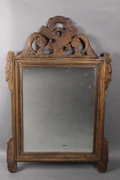 11593. 19th Century Carved European Mirror with ornate carvings featuring floral designs at the top and columns on the sides.
