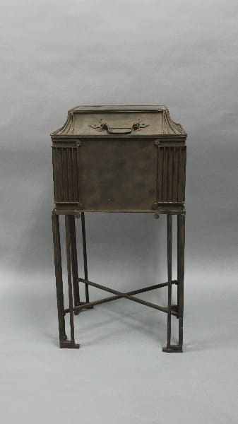 12286. 1930's Tall Iron Ice Chest with a folding top, supported on a slender four-legged stand with crossbars, against a grey backdrop.