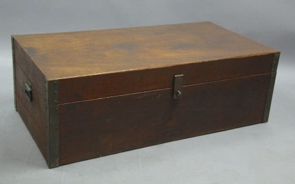 A rectangular 12367 with a smooth finish and a front latch, set against a gray background.