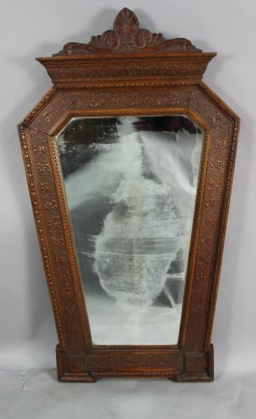 13031. Rare Turn Of the Century Carved Mirror with an ornate frame and a partially cloudy or fogged reflection.