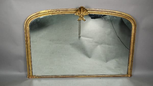 13151. Large Arched Mirror With Acanthus Finial with ornate gold frame and a decorative floral design at the crest, showing signs of age and wear.