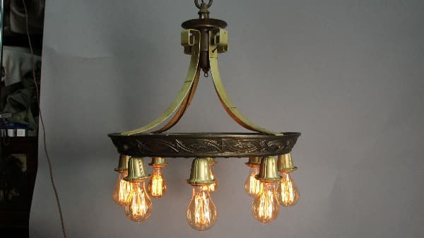 13660. 1920's Polychrome Downlight Chandelier with six illuminated bulbs hanging from a ceiling, against a plain white background.