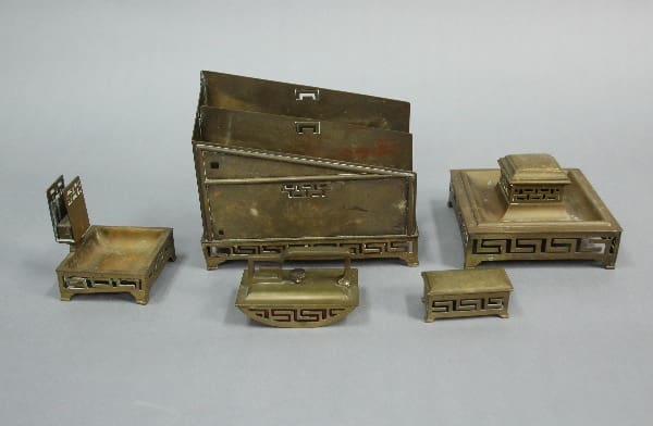 A collection of 13795. Arts And Crafts Desk Set featuring a chest, chairs, and storage boxes with ornate designs on a gray background.