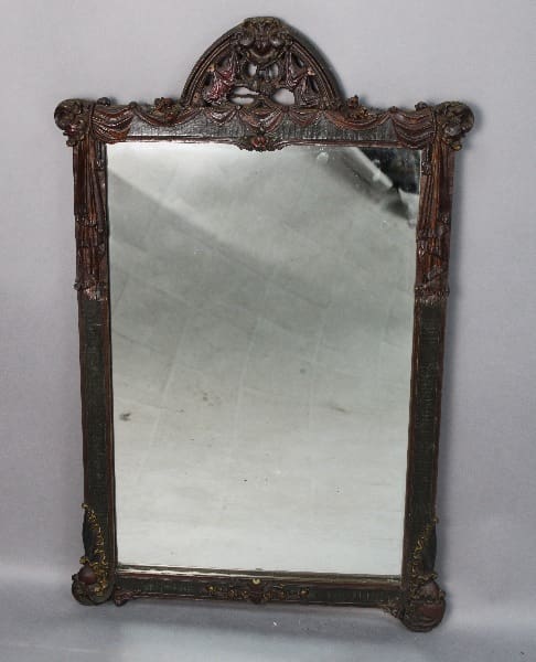 13936. Spanish Revival Polychrome Mirror with a decorative floral and scrollwork frame, showing signs of wear and tarnish.