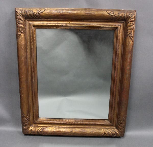 Ornate 14177. 1920's Mirror With New Mirror with an empty gray background on a light gray draped cloth.