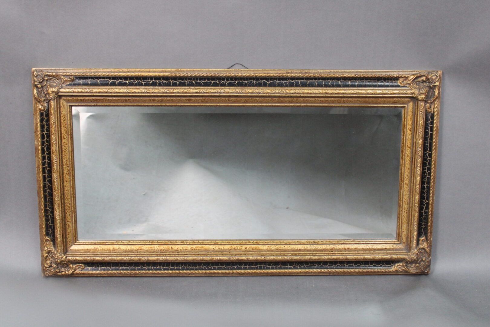 Antique 14193. 1920's Horizontal Mirror With Great Frame with intricate details, displayed against a gray background.