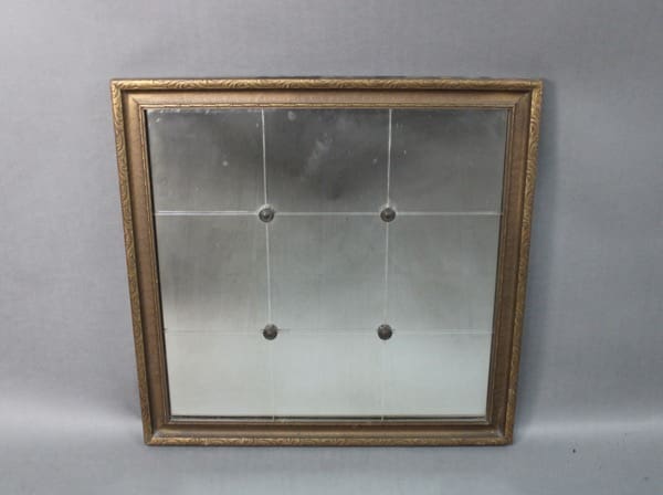 14243. Small 1930's Mirror with a dirty or foggy surface, divided into four quadrants by faint intersecting lines, mounted on a gray background.