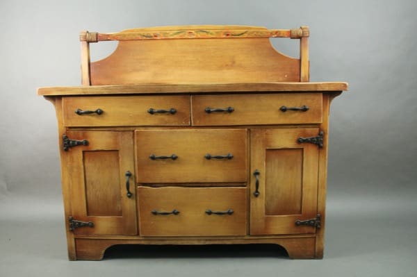 14329. Signed Coronado Sideboard with ornate handles, featuring two cabinets and three drawers, set against a grey background.