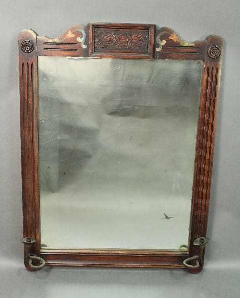 Spanish Revival Hand Painted Mirror With Candle Holders with ornate carvings and metal accents on a gray background.