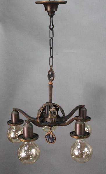 14529. 1920's Bronze 5 Light Chandelier with circular frame, four clear glass globes, and intricate metal details, hanging against a grey backdrop.