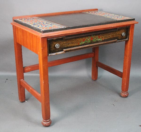 Vintage 14683. De Anza Hotel Desk With Tile with colorful tile top, decorative front drawer, and turned legs on a plain gray background.