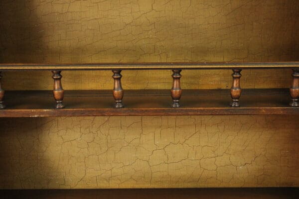 Two 14696. Monterey Period Angelos Furniture Company Hutches with a decorative railing and a cracked paint background.