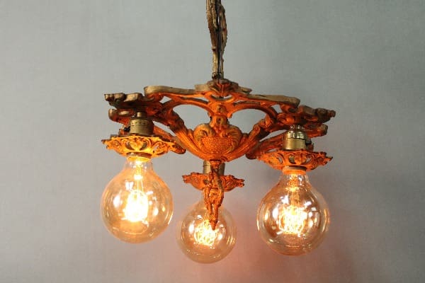 14831. Three Light Spanish Revival Chandelier with ornate metal detailing against a light grey background.