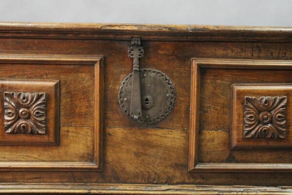 14851. 19th Century Walnut Trunk With Original Hardware featuring ornate metal lock and carved decorative panels.