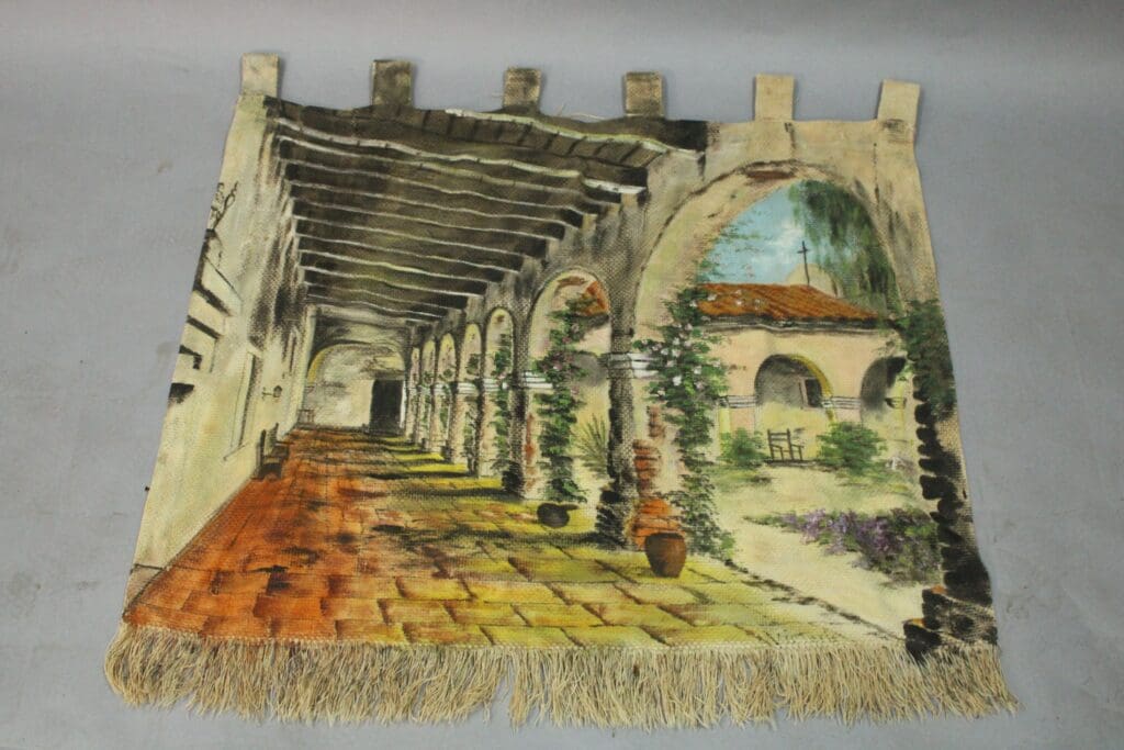 A 14865. Spanish Revival Hand Painted Mural Of California depicting a rustic arched hallway and courtyard with a detailed, colorful design.