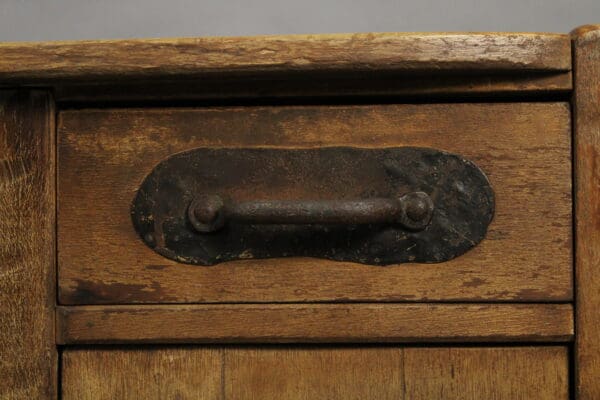 Close-up image of a 15010. Signed Monterey Desk With Original Iron Hardware, showing textured wood and aged patina.