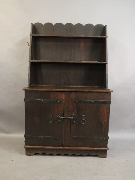 Antique wooden hutch with upper open shelves and lower cabinet doors, featuring scalloped edges and metal handles. 15242. All Original Early Signed Monterey Old Wood Welsh Cupboard with upper open shelves and lower cabinet doors, featuring scalloped edges and metal handles.