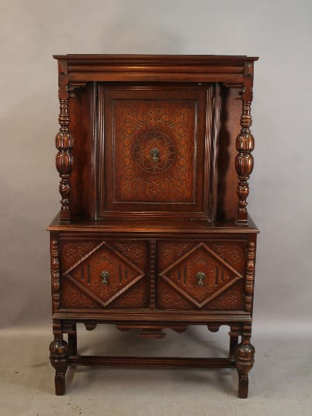 15276. Spanish Revival Standing Cabinet Circa 1920's with detailed carvings, featuring a fold-down door, two drawers, and ornate columns.