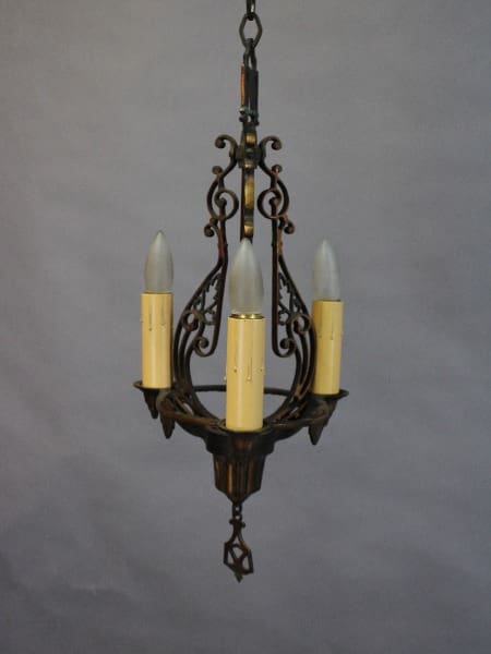 15383. 1920's Three Light Chandelier With Three Lights featuring ornate metalwork and three candle-shaped bulbs against a neutral background.