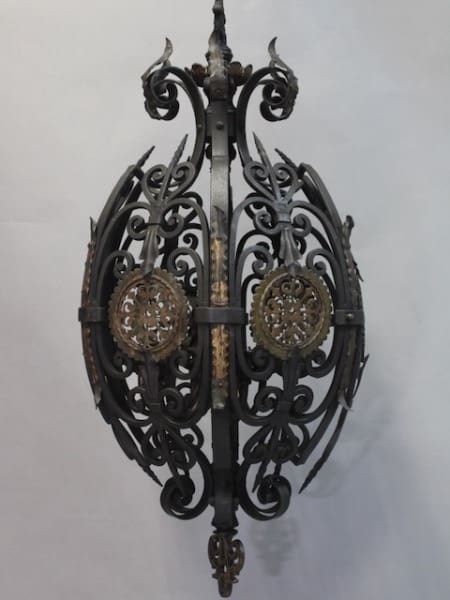 15779. Large Scale Exquisite Wrought Iron Pendant with intricate scroll designs and circular patterns, hanging against a light grey background.