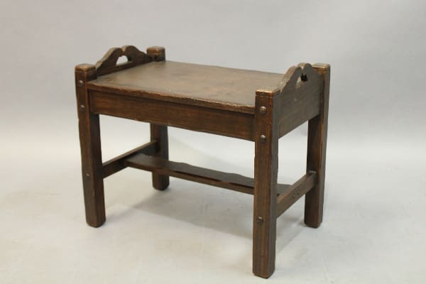 Monterey Period Bench with a flat top and curved handles, supported by four legs connected by horizontal bars, on a plain background.