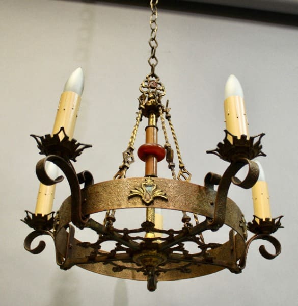 15883. 1920's Polychrome Spanish Revival Chandelier with ornate metalwork and three candle-like bulbs, suspended by a chain.
