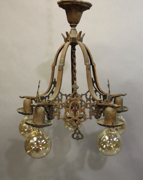 15918. 1920's All original Ceiling Mount Chandelier With Four Bulbs with ornate metalwork and five glass globes, hanging against a plain backdrop.