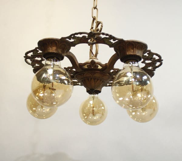 15926. 1920's Five Light Chandelier with three glass globes hanging from a decorative metal frame against a white background.