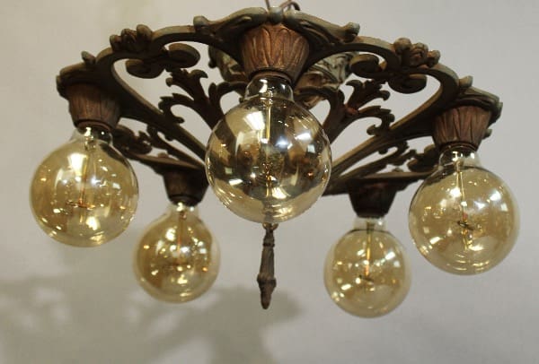 15953, 1920's Ceiling Mount with Original Polychrome finish with ornate detailing and five illuminated spherical bulbs against a light background.