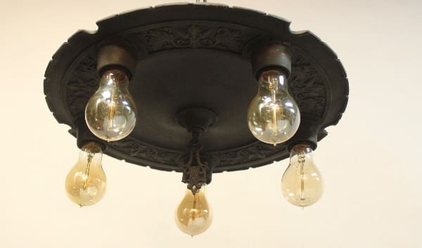 15971. Circa 1920's Ceiling Mount with five exposed bulbs, mounted on a white wall.