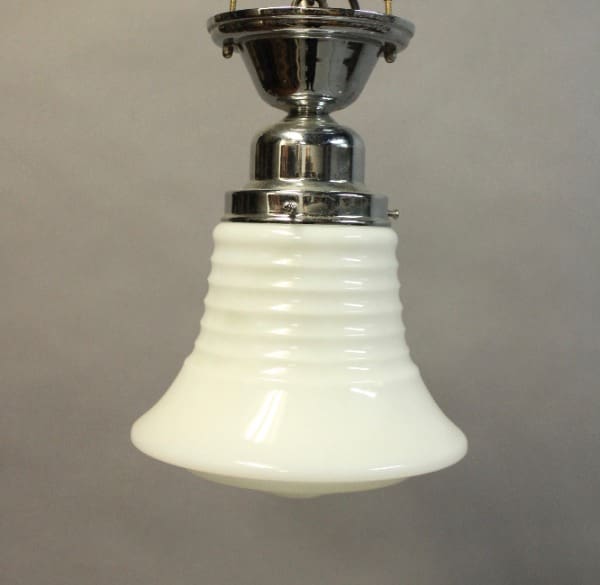 Vintage pendant light with a 16043. Deco Style Ceiling Mount With Ribbed Glass Shade fixture and a white fluted glass shade against a plain background.
