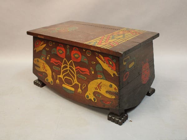 A 16064. Small North American Trunk Circa 1930's with colorful, intricate indigenous designs on a gray background.
