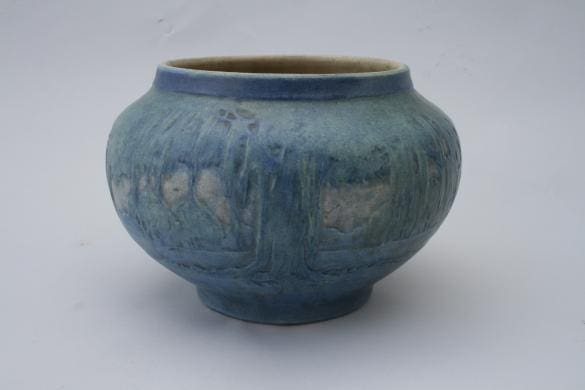 A 2160. Newcomb College Vase with a textured exterior and a smooth rim, displayed against a plain white background.
