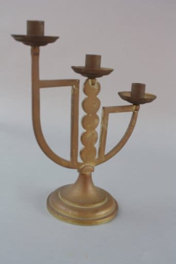A 7412. Turn Of The Century Brass Candelabra with a central stem featuring a spiral design, flanked by curved branches ending in candle holders.
