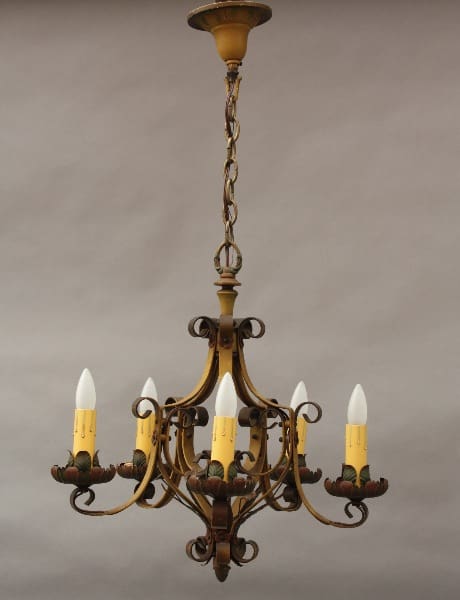 9176. 1920's Polychrome Spanish Revival Chandelier with five candle-like bulbs hanging from a chain against a gray background.