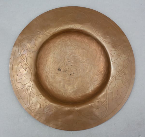 Copper plate with etched ivy design.