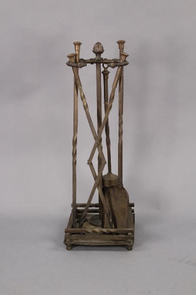 A model 10063. Fantastic Brass Fire Tool Set with a wooden frame and blade, featuring twisted columns and an elevated platform.