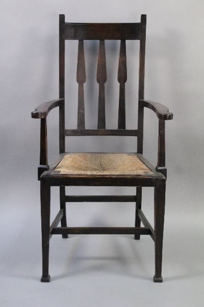 10271. Arts And Crafts Chair With Rush Seat with a high back and woven seat, set against a gray background.