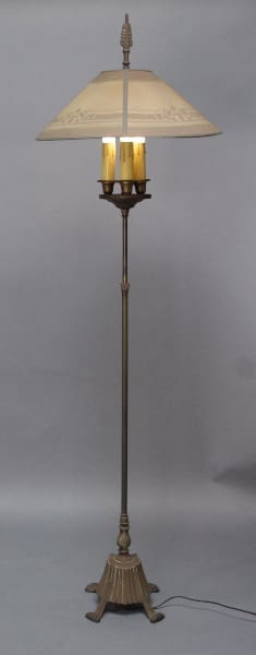 Vintage floor lamp with a three-light shade.