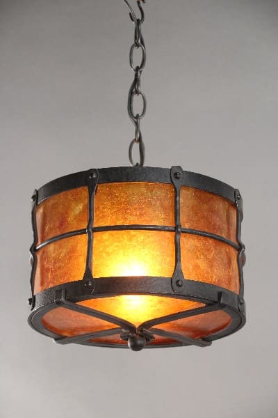 Round, amber glass pendant light fixture.